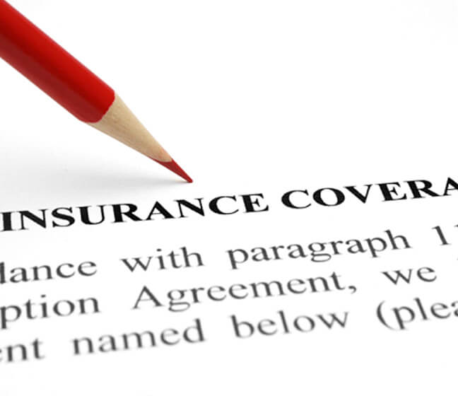 insurance coverage policy and red pencil