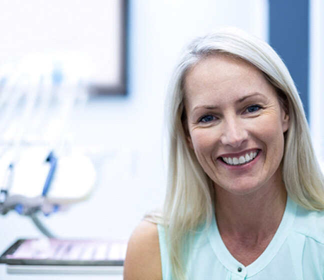 Smiling older woman in dental office