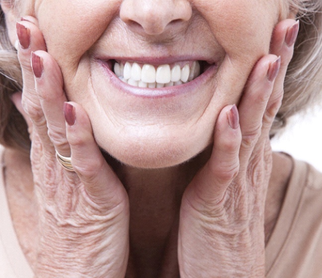 Closeup of senior woman with dentures in Dallas