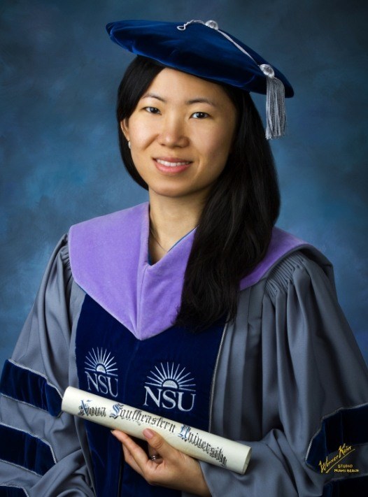 Doctor Liu wearing graduation cap and gown
