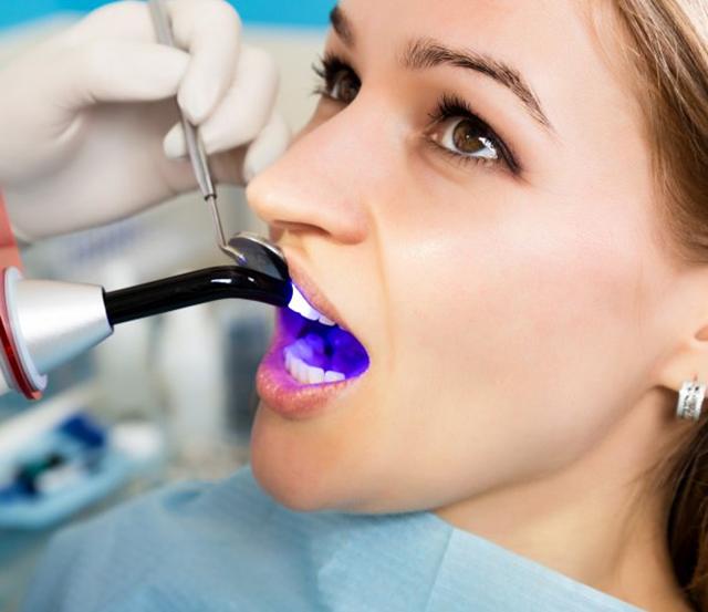 a patient undergoing a tooth colored filling procedure
