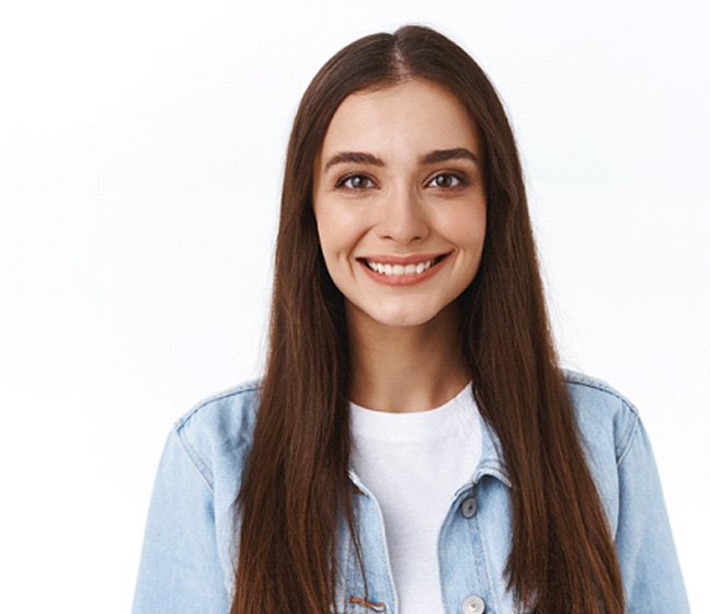 woman smiling after root canal therapy in Dallas