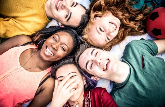Group of young people with attractive smiles after cosmetic dentistry