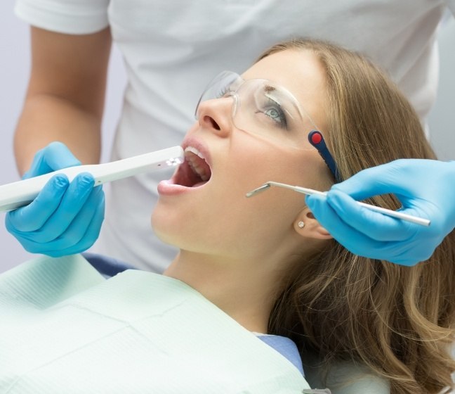 Dentist using intraoral camear to capture smile images