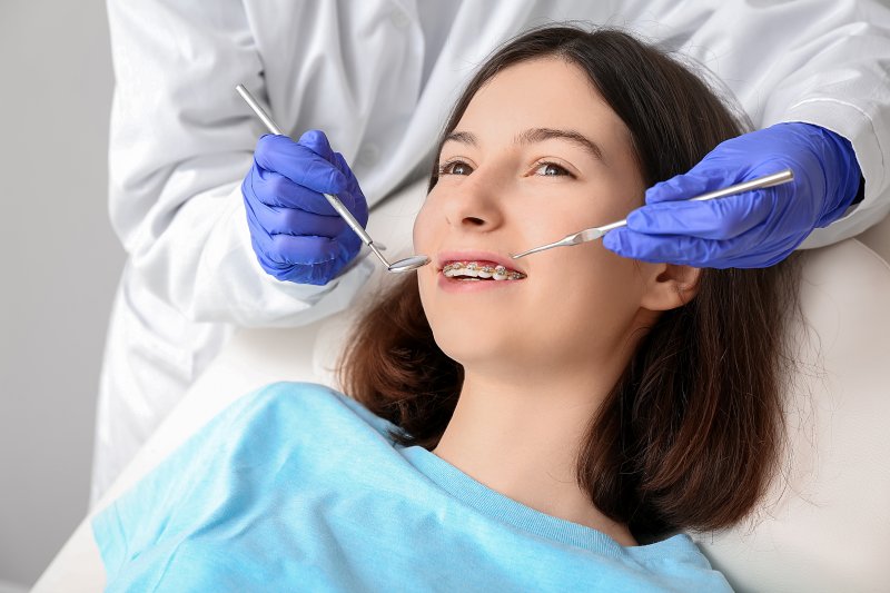 A teenage girl having a dental exam