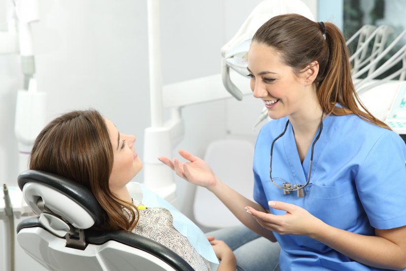 dentist talking to patient about benefits of tooth-colored fillings