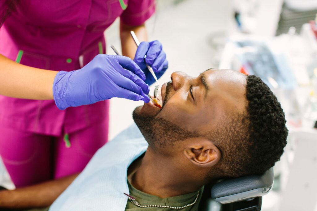 Man having teeth examined