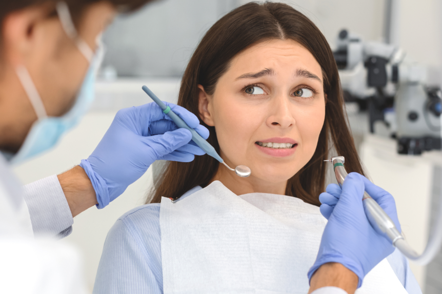 Patient looking stressed in dental chair